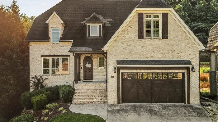 Brick and stone home exterior at golden hour